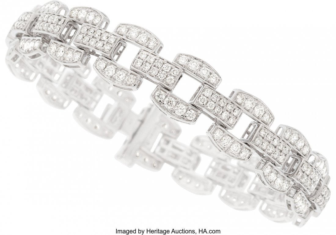 Diamond, White Gold Bracelet Stones: Full-cut d: Diamond, White Gold Bracelet Stones: Full-cut diamonds weighing a total of 4.95 carats Metal: 14k white gold Gross Weight: 18.80 grams Dimensions: 7-1/4