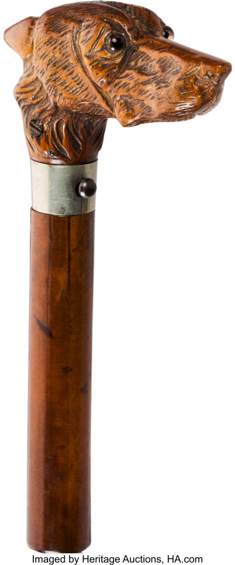 Superb and Scarce Dog's Head Rifle Cane. Unser: Superb and Scarce Dog's Head Rifle Cane. Unserialized, approximately 30. caliber centerfire, 32-inch length from collar. Hardwood stock handle and form over iron const
