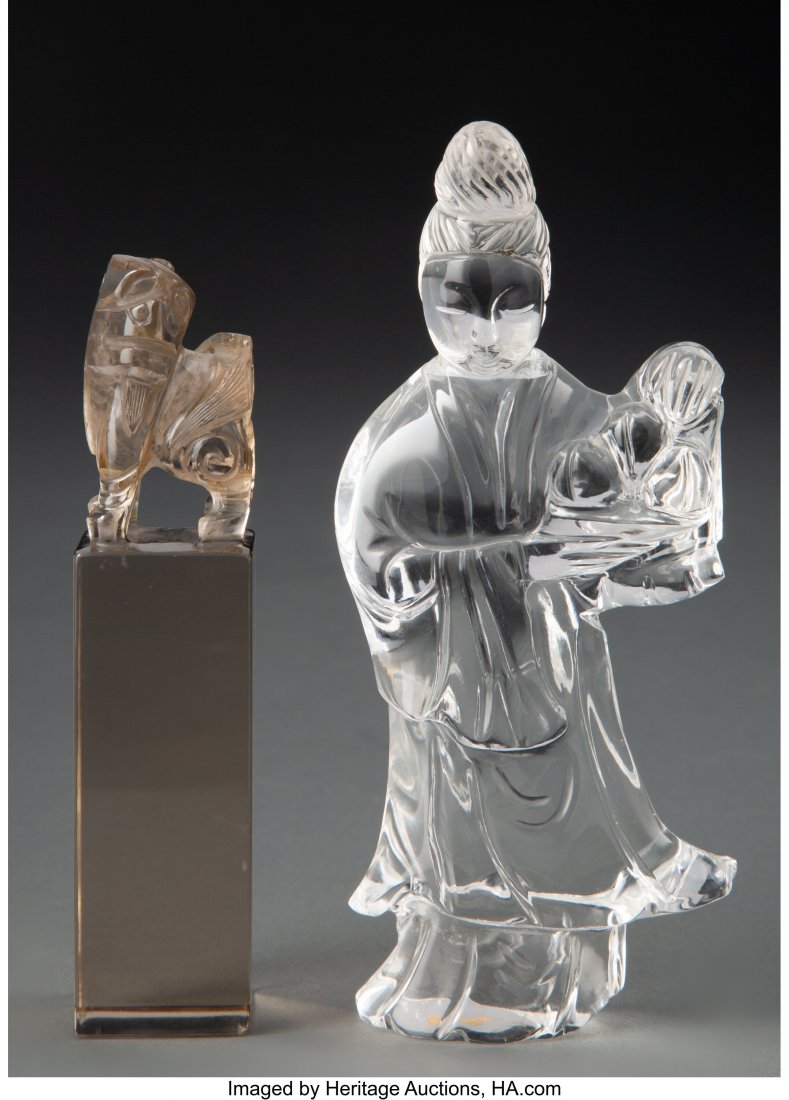 Two Chinese Carved Quartz Articles 5-1/2 x 2-1/2: Two Chinese Carved Quartz Articles 5-1/2 x 2-1/2 inches (14.0 x 6.4 cm) The lot comprising one figure of a beauty in colorless quartz, and one guardian lion-toppe