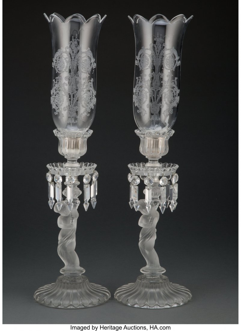 A Pair of Baccarat Enfants Pattern Glass Candles: A Pair of Baccarat Enfants Pattern Glass Candlesticks with Acid-Etched Glass Hurricanes, 20th century Marks to each: BACCARAT, (goblet-decanter-cup), FRANCE 24-1/