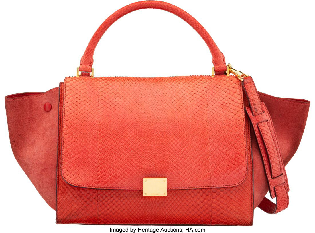 Celine Red Python & Suede Trapeze Bag Condition: Celine Red Python & Suede Trapeze Bag Condition: 4 20" Width x 9" Height x 6" Depth This bag is done in red python and suede and gold hardware, featuring one rear zip pocket, a r