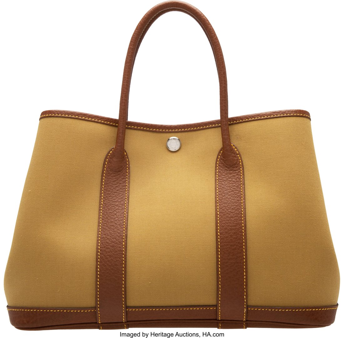 Hermès Khaki Toile & Noisette Negonda Leather G: Hermès Khaki Toile & Noisette Negonda Leather Garden Party 30 Bag with Palladium Hardware L Square, 2008 Condition: 2 12.5" Width x 8" Height x 6" Depth This bag is done 
