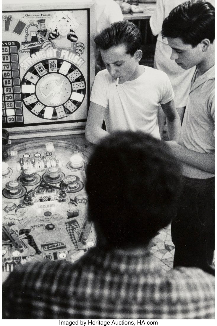 Will McBride (American, 1931-2015) Boys at a Pin: Will McBride (American, 1931-2015) Boys at a Pinball Machine, near Florence, Italy, 1957 Gelatin silver print on Agfa paper, printed 1970s 17-1/2 x 12 inche