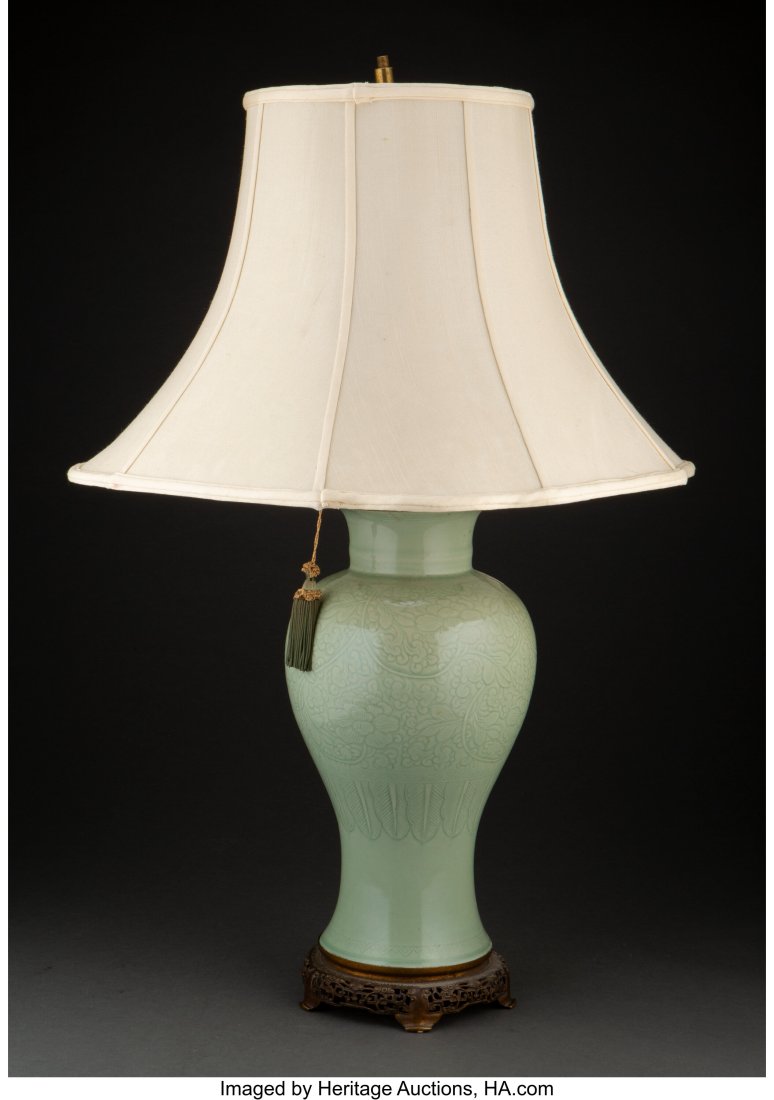 A Converted Chinese Celadon Porcelain Vase: A Chinese Celadon Porcelain and Gilt Bronze Mounted Vase Converted to Table Lamp with Shade 31 x 8-1/2 x 8-1/2 inches (78.7 x 21.6 x 21.6 cm) Property from the Estate of Dr. Terry Berreth, Palm Spring