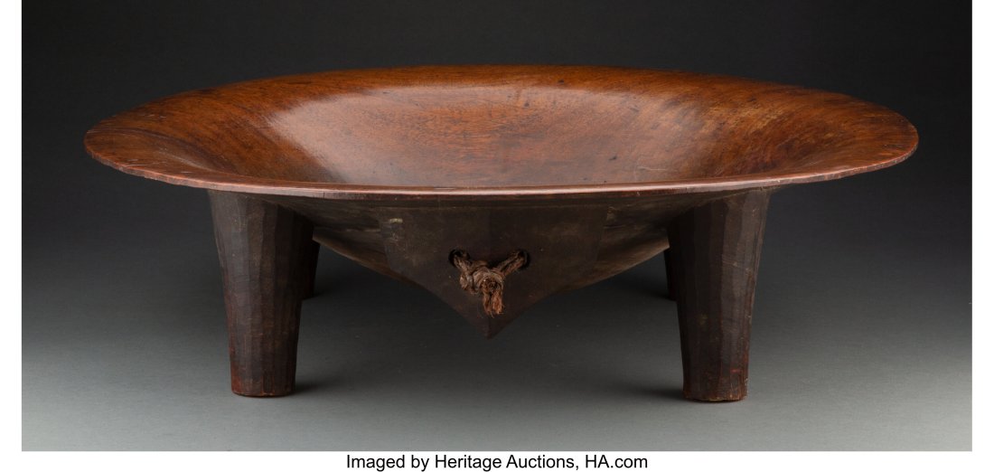 A Kava (yaqona) Bowl Fiji, c. 19th century Hea: A Kava (yaqona) Bowl Fiji, c. 19th century Heavy hardwood (intsia bijuga - a type of teak) wide flaring bowl on four tapering legs, the whole with a rich brown c