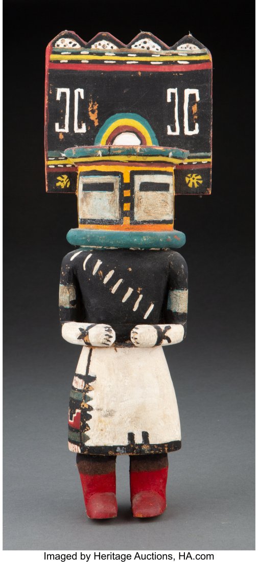 A Hopi Kachina Doll c. 1950 representing Sio : A Hopi Kachina Doll c. 1950 representing Sio Hemis, cottonwood, paint, cotton string, with circular tag inscribed 19th Cent. Provenance: Purchased by the cu