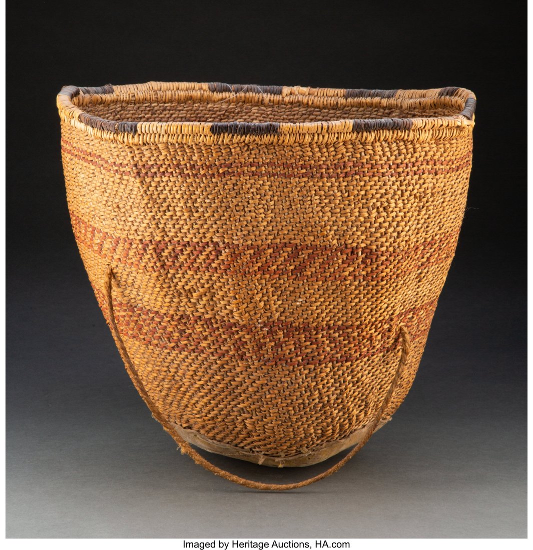 A Large Apache Twined Burden Basket c. 1900 w: A Large Apache Twined Burden Basket c. 1900 willow, devil's claw, hide, yellow ochre pigment, fiber cord Height: 17 inches HID03101062020 &NewLi