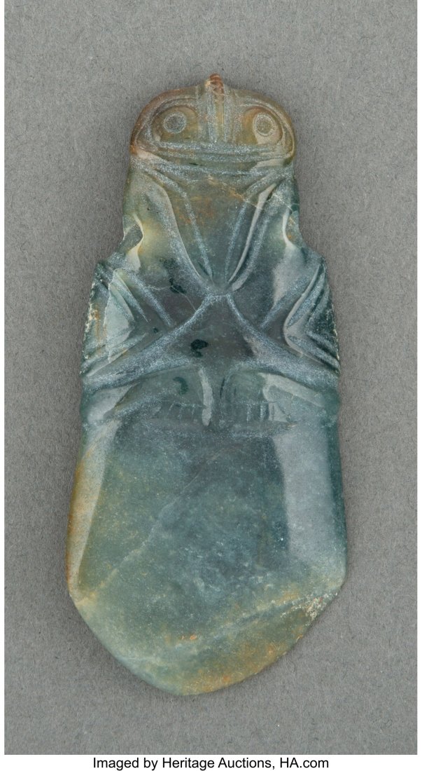 A Jade Avian Axe God Celt Pendant Costa Rica, c: A Jade Avian Axe God Celt Pendant Costa Rica, c. 200 - 600 AD Carved from translucent blue-green jade with a high polish. Depicts an Olmecoid duck with stylized small wings and tal