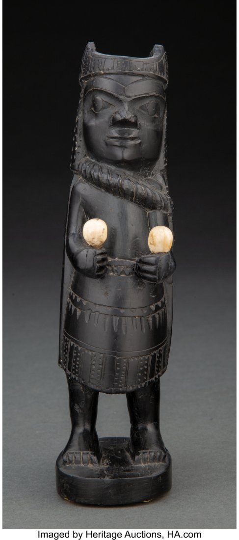 A Haida Shaman c. 1920 argillite, with old tag: A Haida Shaman c. 1920 argillite, with old tag affixed to the bottom, inscribed Dr. H. J. Wasson, Totem Pole, Medicine Man Provenance: Propert