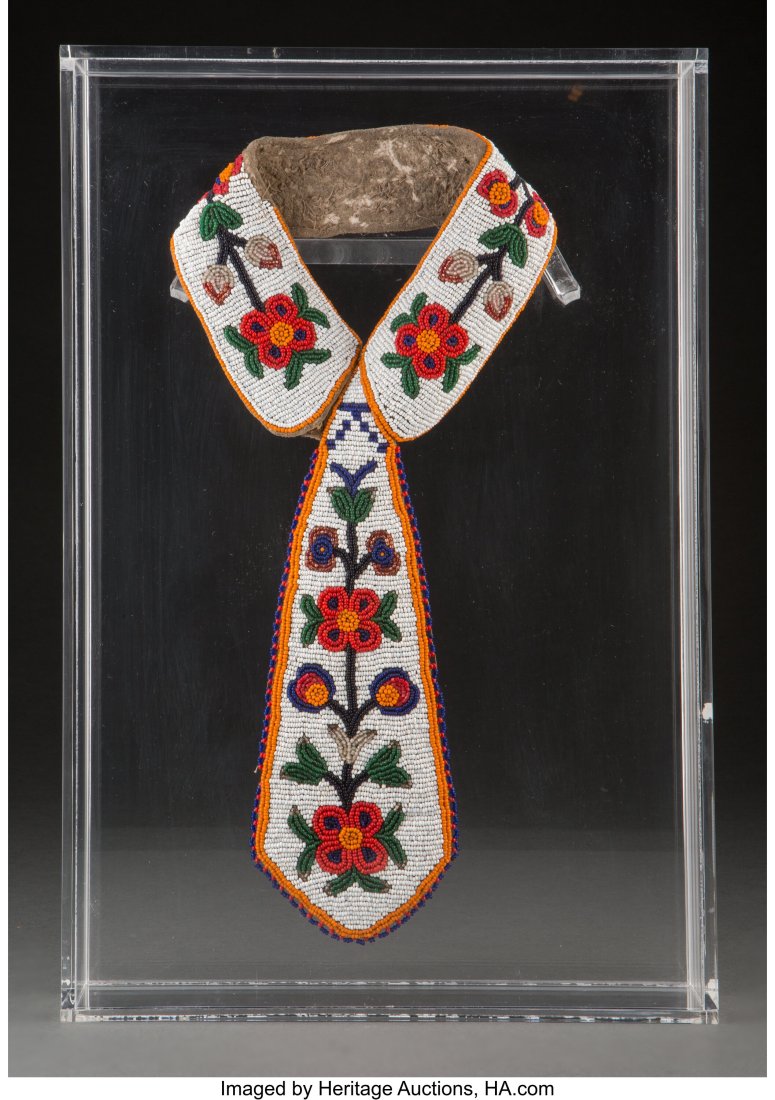 A Plateau Beaded Buffalo Hide Collar and Tie mo: A Plateau Beaded Buffalo Hide Collar and Tie mounted in an acrylic box Provenance: Property from the Finegood Estate, Los Angeles, CA Length: 14 &frac12; inches &NewLi