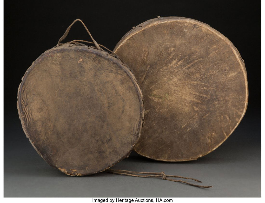 Two Plains Drums accompanied by a copy of a: Two Plains Drums accompanied by a copy of a notarized document, inscribed Old Indian War Drum - This old drum is a war drum and is very old. It was used by the Indians when they held thei
