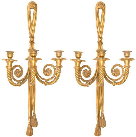 A PAIR OF FRENCH GILT BRONZE THREE-LIGHT SCONCES: A PAIR OF FRENCH GILT BRONZE THREE-LIGHT SCONCES ATTRIBUTED TO MAISON BAGUES Attribut