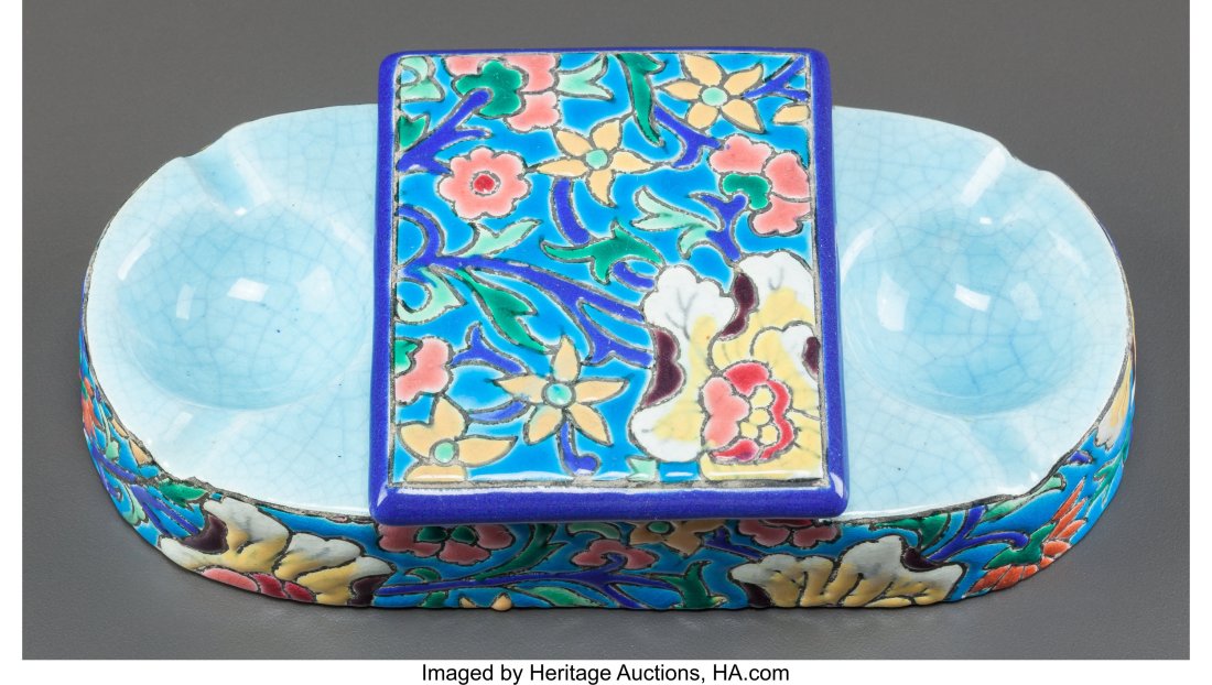 A Longwy Faience Covered Cigarette Box with Ash: A Longwy Faience Covered Cigarette Box with Ash Receivers, early 20th century Marks: LONGWY, DÉCORÉ À LA MAIN, FRANCE 2 x 7 x 4 inches (5.1 x 1