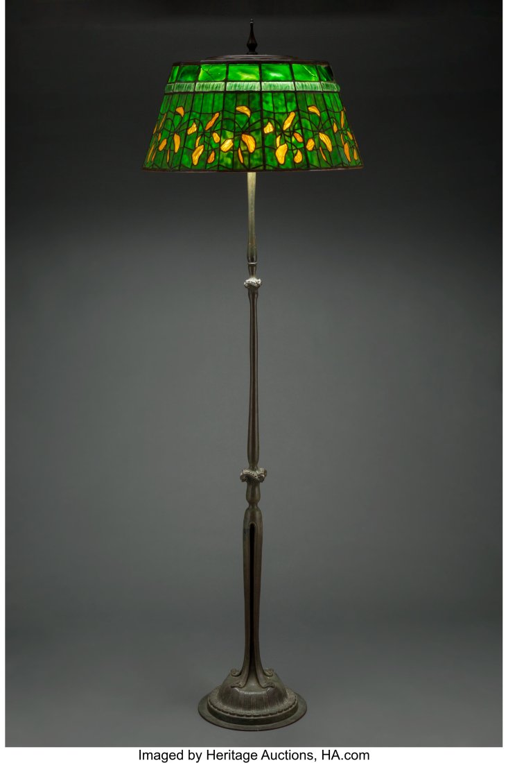 Tiffany Studios Patinated Bronze Floor Lamp Base with Later: Tiffany Studios Patinated Bronze Floor Lamp Base with Later Leaded Glass Swirling Leaves Shade, circa 1910 and laterMarks: TIFFANY STUDIOS, NEW YORK, 57756 inches (142.2 cm) HID03101062020Â© 2022 He