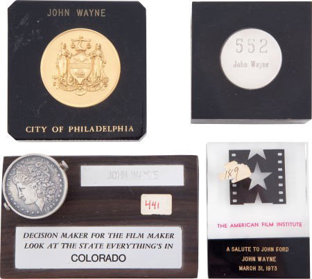 Four Paperweights, 1970s.: Four Paperweights, 1970s. All engraved "John Wayne;" the first from the C