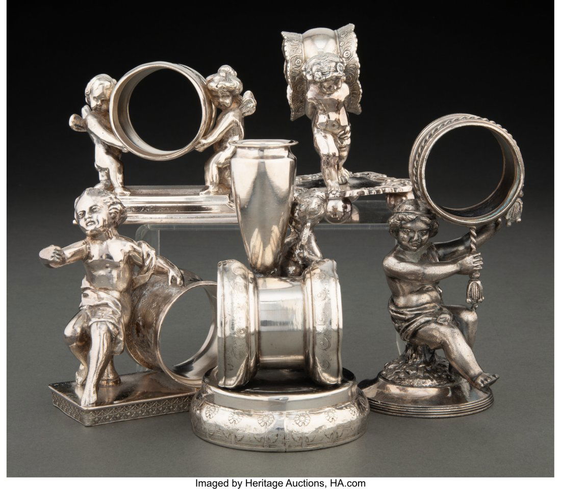 Lot of Five Silverplate Classical Figure Napkin: Lot of Five Silverplate Classical Figure Napkin Rings, circa 1900 Marks: ROCKFORD QUADRUPLE SILVER PLATED, 178 (tallest, figure with urn) 4-3/4 inches (11&pe