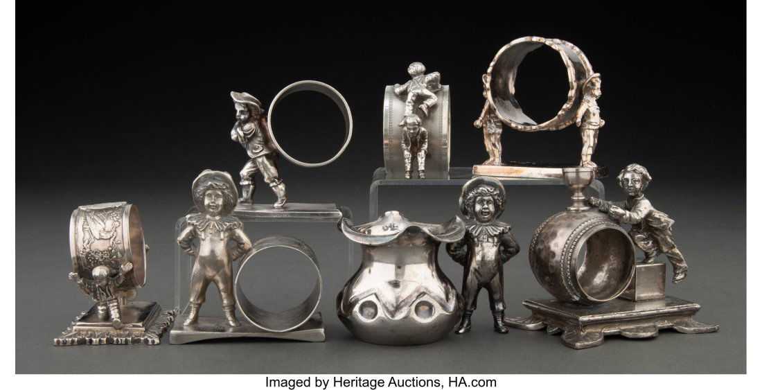 Lot of Seven Silverplate Figural Napkin Rings, c: Lot of Seven Silverplate Figural Napkin Rings, circa 1900 Marks: unmarked 3-1/2 inches (8.9 cm) (tallest, boy with cup) Inscription: various &New