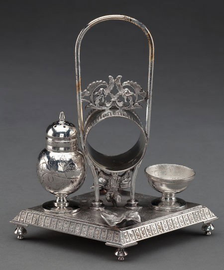 A MERIDEN BRITANNIA SILVER-PLATED COMBINATION NA: A MERIDEN BRITANNIA SILVER-PLATED COMBINATION NAPKIN RING WITH SALT AND PEPPER Meride