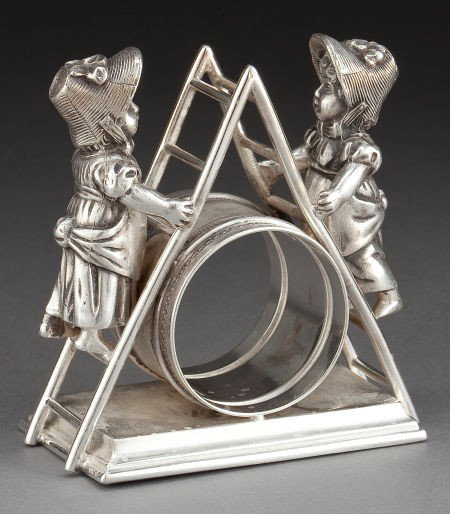 A SIMPSON, HALL, MILLER SILVER-PLATED FIGURAL NA: A SIMPSON, HALL, MILLER SILVER-PLATED FIGURAL NAPKIN RING Simpson, Hall, Miller & Co.