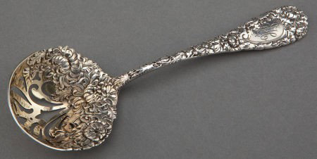 A DURGIN SILVER AND SILVER GILT SLOTTED SPOON RE: A DURGIN SILVER AND SILVER GILT SLOTTED SPOON RETAILED BY BLACK, STARR & FROST Wm. B.