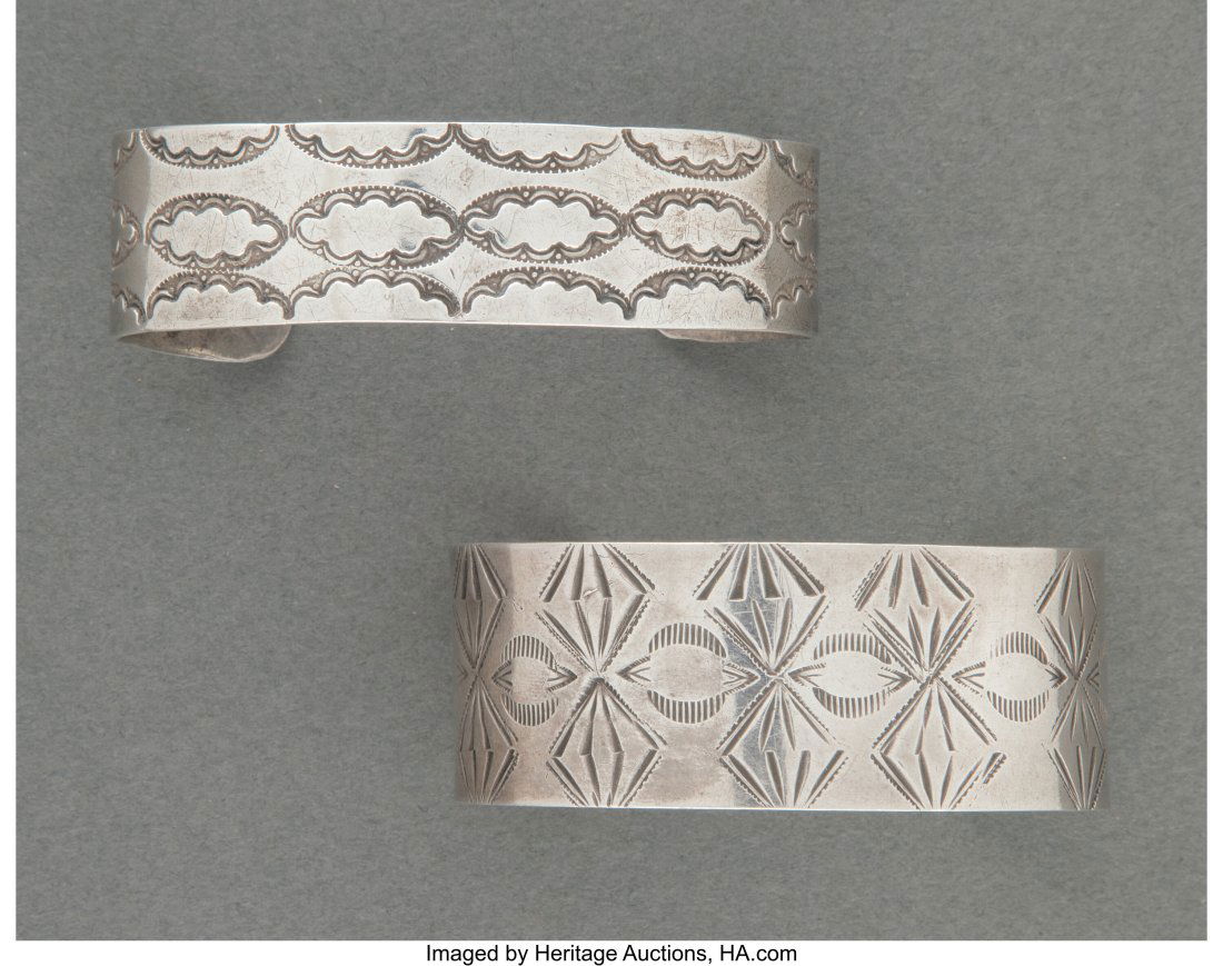 Two Navajo Silver Cuff Bracelets Each stamped: Two Navajo Silver Cuff Bracelets Each stamped with repeating geometric designs. Widths: 2 &frac12; and 2 &frac34; inches HID03101062020 &New