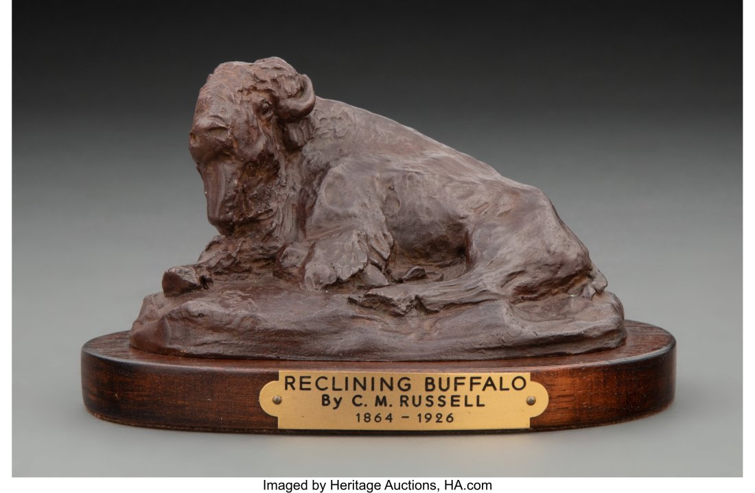 After Charles Marion Russell (American, 1864-192: After Charles Marion Russell Reclining Buffalo Bronze with dark brown patina, Posthumous cast 2-5/8 inches (6.7 cm) high on a 5/8 inches (1.6 cm) high wood base Ed. 9/30 Inscribed on base: CMR / 9/30 