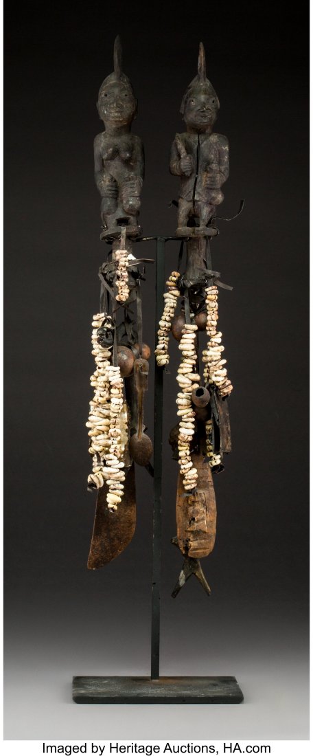 A Pair of Yoruba Eshu Staffs with Original Accou: A Pair of Yoruba Eshu Staffs with Original Accouterments Priests Nigeria Rarely does one encounter a pair like this with all the magical and representational attachments still present. Suspende