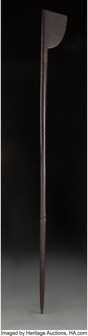 A Maori War Club, tewhatewha New Zealand, 19th : A Maori War Club, tewhatewha New Zealand, 19th century Hardwood with a glossy patina from handling, especially on the shaft. A finely carved manaia head on the shaft. P