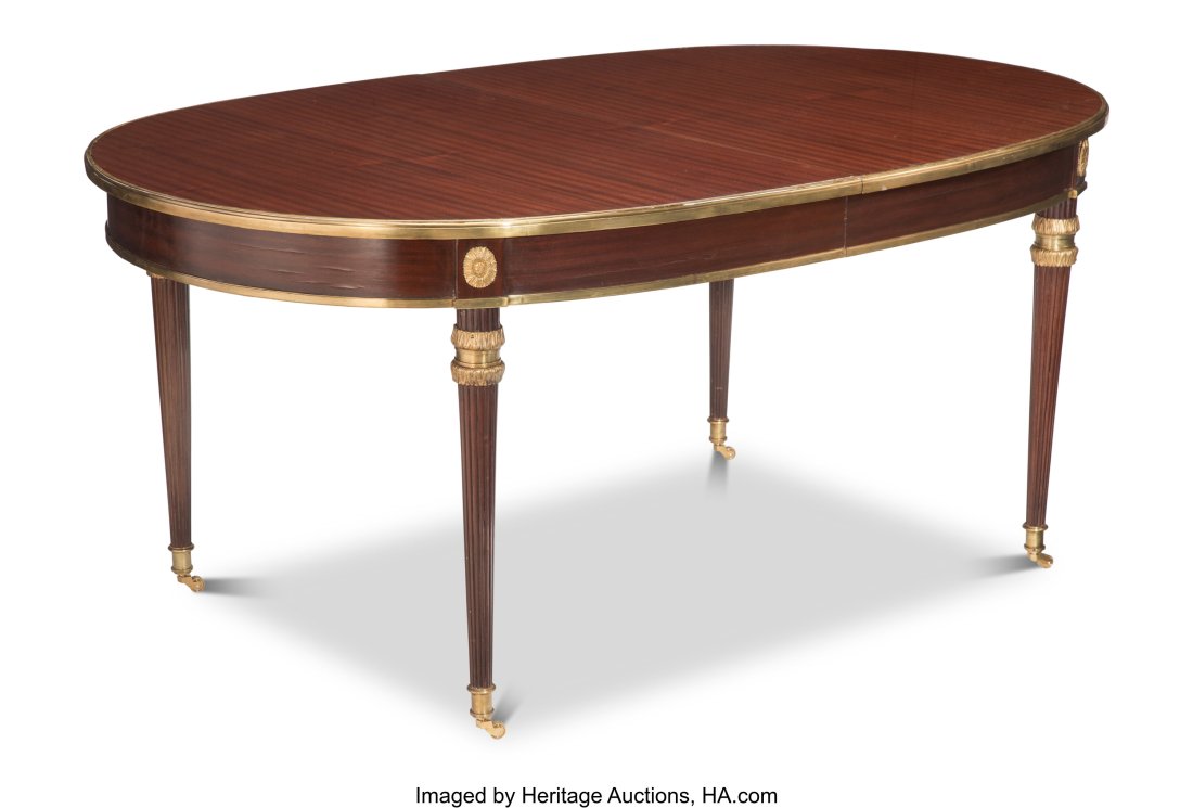 An Empire-Style Gilt Bronze Mounted Mahogany Din: An Empire-Style Gilt Bronze Mounted Mahogany Dining Table, 20th century 31-3/4 x 72 x 44-1/2 inches (80.6 x 182.9 x 113.0 cm) Property from a Private North