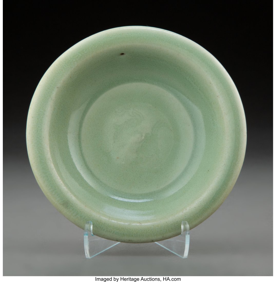 A Chinese Celadon Glazed Porcelain Bowl 1-1/4 x: A Chinese Celadon Glazed Porcelain Bowl 1-1/4 x 4-7/8 inches (3.2 x 12.4 cm) Property form the Estate of Dr. Cornelius Osgood and Soo Sui-ling Osgood; &NewL