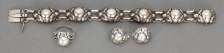 A FOUR PIECE GEORG JENSEN SILVER JEWELRY SET Ge: A FOUR PIECE GEORG JENSEN SILVER JEWELRY SET Georg Jensen, Inc., Copenhagen, Denmark,