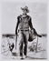 46032: A John Wayne Signed Black and White Photograph,