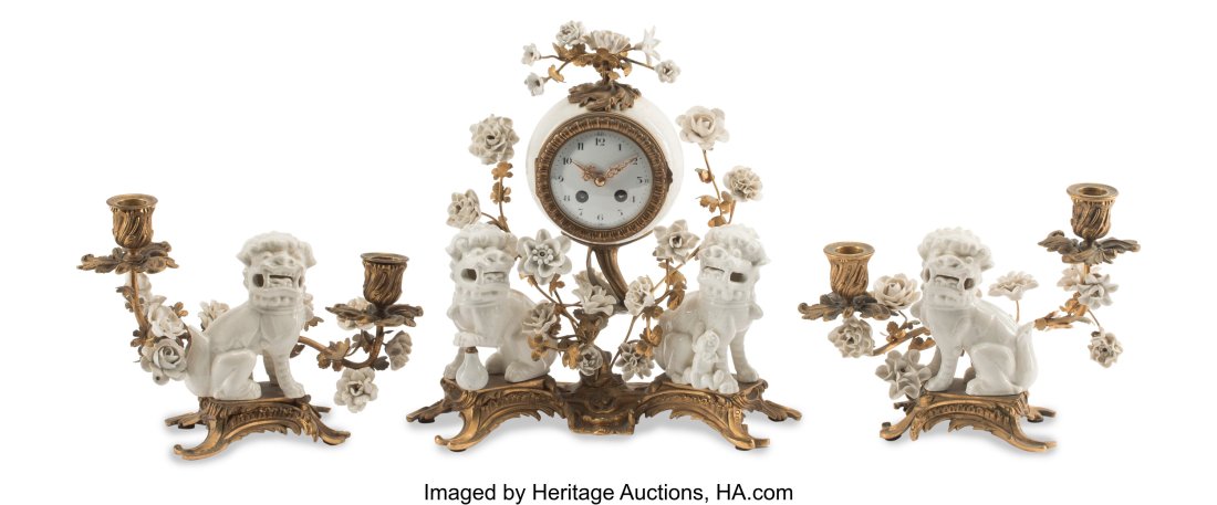 A Three-Piece French Gilt Bronze-Mounted Blanc d: A Three-Piece French Gilt Bronze-Mounted Blanc de Chine Porcelain Clock Garniture, 19th century 13 x 12 x 5-1/2 inches (33.0 x 30.5 x 14.0 cm) (largest&co