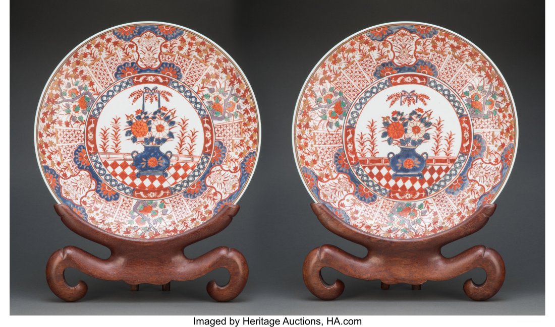 A Pair of Large Japanese Imari Porcelain Charger: A Pair of Large Japanese Imari Porcelain Chargers on Hardwood Stands, late 19th century 2-1/2 x 17-7/8 inches (6.4 x 45.4 cm) (charger, each) Prop