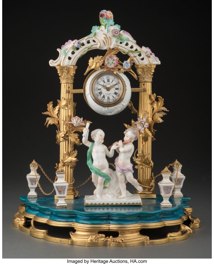 A Continental Gilt Bronze and Porcelain Mantel C: A Continental Gilt Bronze and Porcelain Mantel Clock, 19th century and later 13 x 11-1/2 x 7 inches (33.0 x 29.2 x 17.8 cm) Property from a La Jolla, Cal