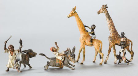 FOUR AUSTRIAN COLD-PAINTED BRONZE FIGURES: BOYS : FOUR AUSTRIAN COLD-PAINTED BRONZE FIGURES: BOYS WITH DONKEYS AND GIRAFFES 