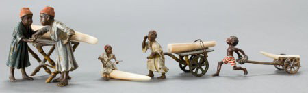 FOUR AUSTRIAN COLD-PAINTED BRONZE FIGURES: BOYS : FOUR AUSTRIAN COLD-PAINTED BRONZE FIGURES: BOYS WITH IVORY TUSKS <