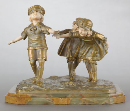 A FRENCH PATINATED GILT BRONZE AND IVORY FIGURAL: A FRENCH PATINATED GILT BRONZE AND IVORY FIGURAL GROUPING BY DEMETRE CHIPARUS (ROMANIAN, 1886-1947)&nb