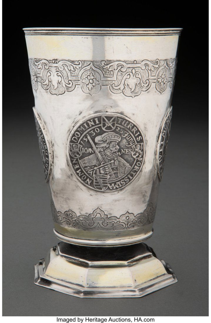 A German Partial Gilt Silver Beaker Inlaid with: A German Partial Gilt Silver Beaker Inlaid with Four Taler Coins, Naumburg, Germany, 18th century Marks: (crossed key and sword over 12), IHH, B, T 5-5/8 x 3-1/4 inches (14.3 x 8.3 cm) 254 grams (8.16