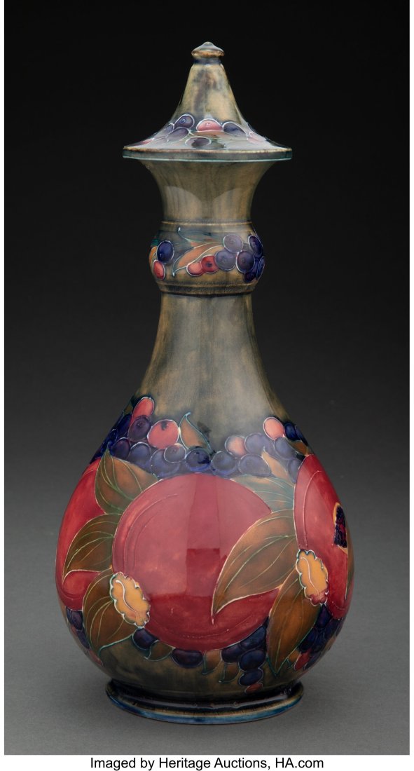 Moorcroft Glazed Earthenware Pomegranate Bottle,: Moorcroft Glazed Earthenware Pomegranate Bottle, circa 1915 Marks: W. Moorcroft, 24 9-7/8 inches (25.1 cm) HID03101062020 © 2022 Heritage Auctions &v