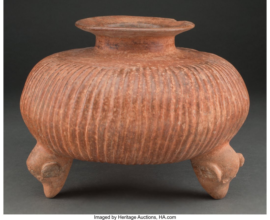 A Colima Tripod Vessel West Mexico, c. 250 BC -: A Colima Tripod Vessel West Mexico, c. 250 BC - 250 AD The three legs supporting the large gadrooned vessel are dog heads with their snouts touching the ground. Each head is nicely