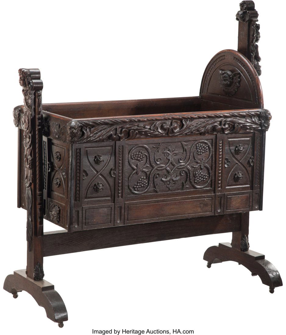 A Renaissance Revival Carved Oak Swinging Cradle (1 of 4)