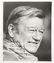 46032: A John Wayne Signed Black and White Photograph,