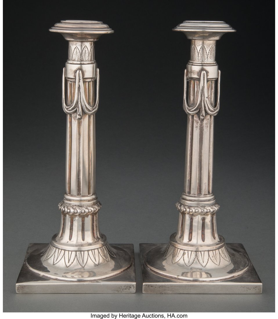 A Pair of Augsburg Silver Candlesticks Marks: (p: A Pair of Augsburg Silver Candlesticks Marks: (pine cone over F), ICN 9-1/2 x 4-1/8 x 4-1/8 inches (24.1 x 10.5 x 10.5 cm) (each&r
