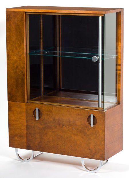 A GILBERT ROHDE BURL WALNUT AND GLASS CHINA CABI: A GILBERT ROHDE BURL WALNUT AND GLASS CHINA CABINET FOR HERMAN MILLER Designed by Gil