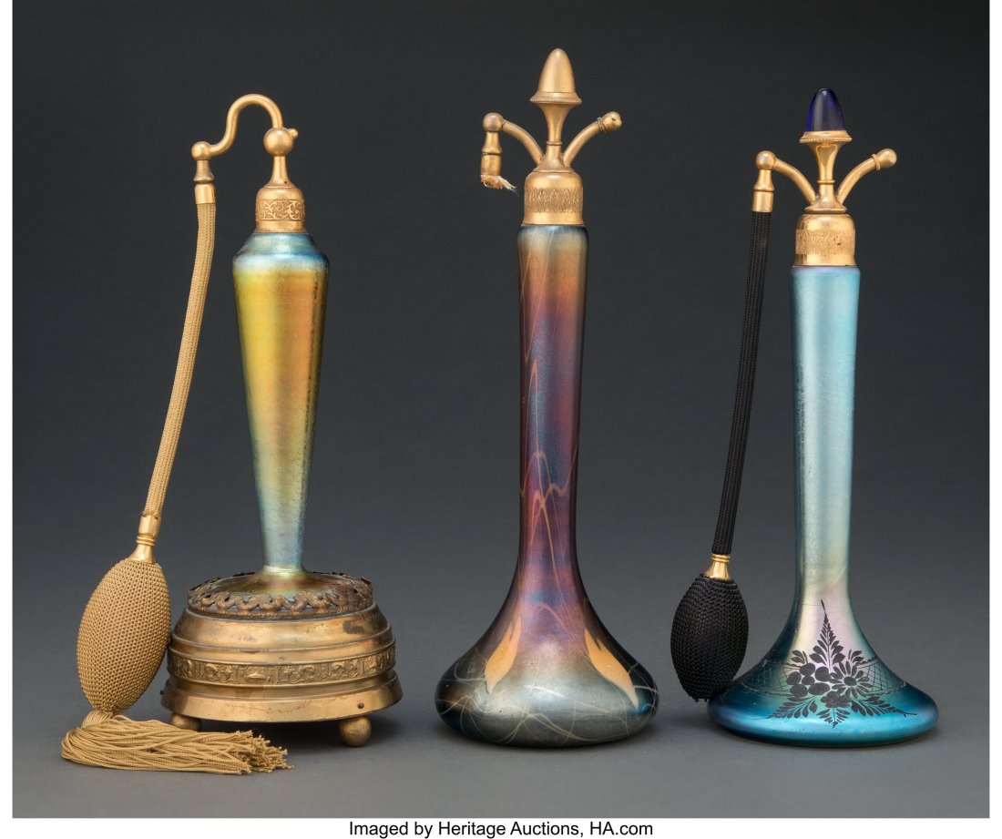 Three American Iridescent Glass Atomizers, circa: Three American Iridescent Glass Atomizers, circa 1910 10-1/4 inches (26.0 cm) (tallest) HID03101062020 © 2023 Heritage Auctions | All Rights Reserved