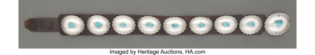 A Navajo Concho Belt c. 1965 silver, turquoise: A Navajo Concho Belt c. 1965 silver, turquoise, commercial leather Provenance: Property form the Donna Gold Family Collection of Ethnographic Art, Los Angeles, CA 