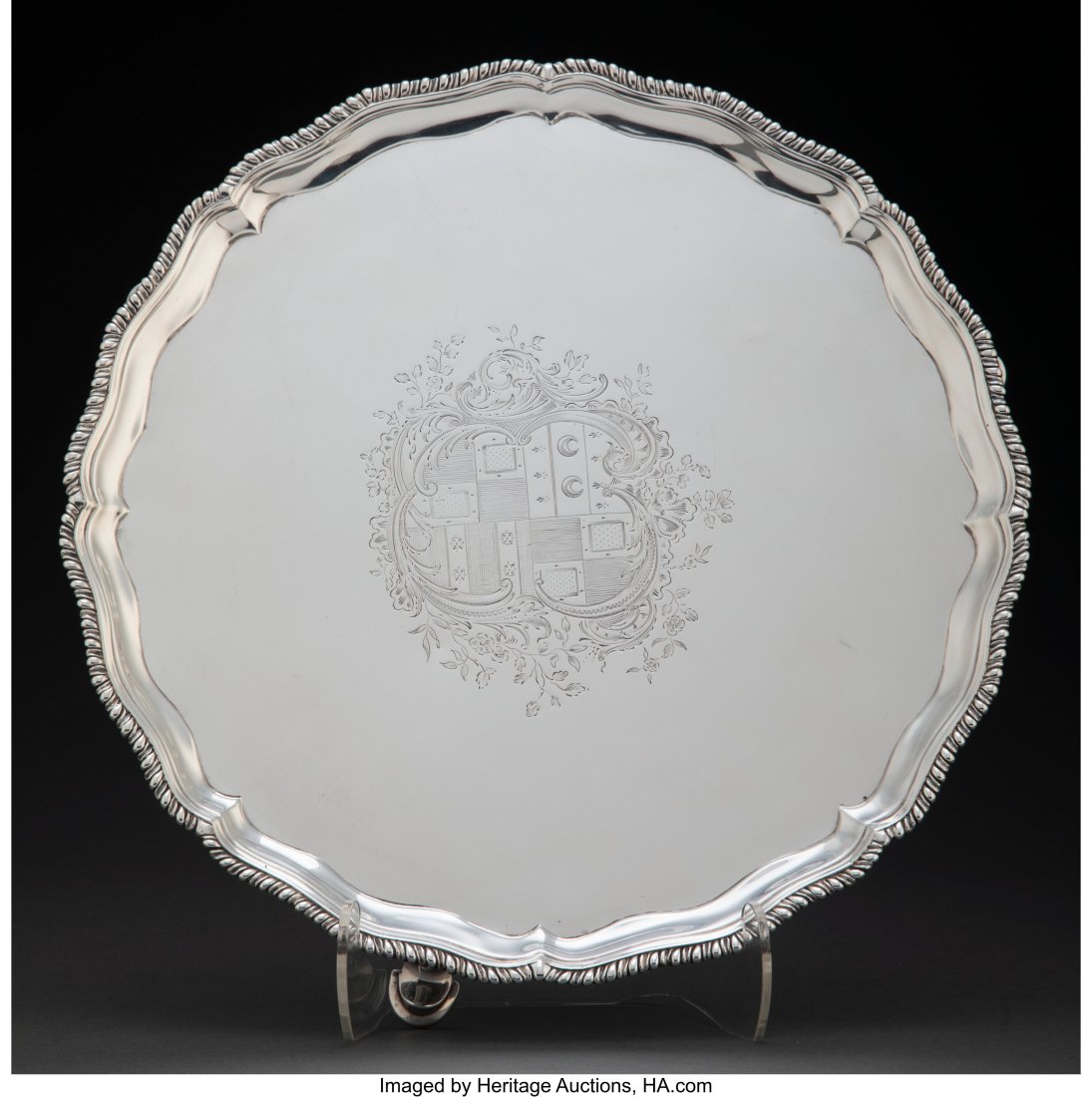 A Robert Jones I Silver Salver, London, 1775 Mar: A Robert Jones I Silver Salver, London, 1775 Marks: (lion passant), (crowned leopard's head), R.I, U 1-1/2 x 11 inches (3&period