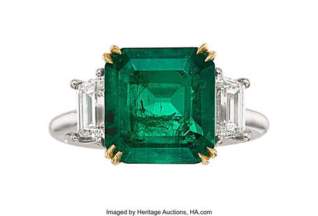 55322: Colombian Emerald, Diamond, Platinum, Gold Ring : Colombian Emerald, Diamond, Platinum, Gold Ring Stones: Emerald-cut emerald weighing 5.13 carats; trapezoid-shaped diamonds weighing a total of approximately 1&peri