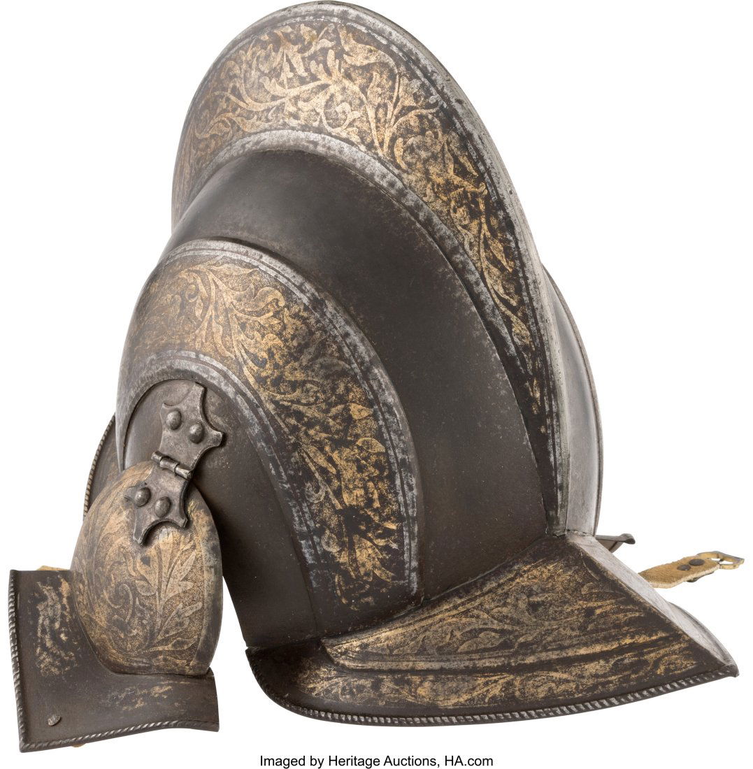 An Etched and Gilded Parade Burgonet. Approxim: An Etched and Gilded Parade Burgonet. Approximately 11-inches tall. The steel helmet of classic traditional form but in stages, with skull forged in two-piece. Smooth medial